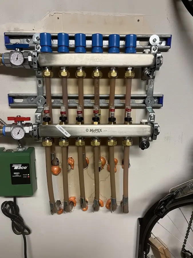 Plumber performing Water Heater Repair at a residential property in Bemiss